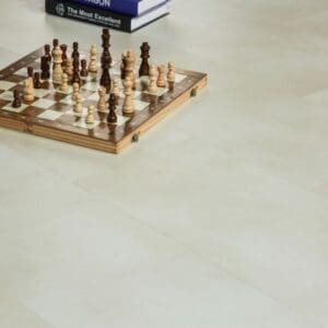Nordikka Naturals Pebble flooring in a home setting with a wooden chessboard and books