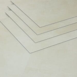 Close up of stacked Nordikka Naturals Pebble tiles demonstrating the 3mm thickness and clean edges