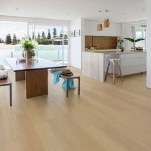 Modern open plan kitchen and dining area featuring Swiss Larch wood effect flooring