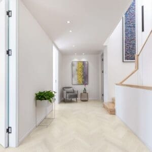 Modern bright hallway featuring Pale Birch herringbone LVT flooring