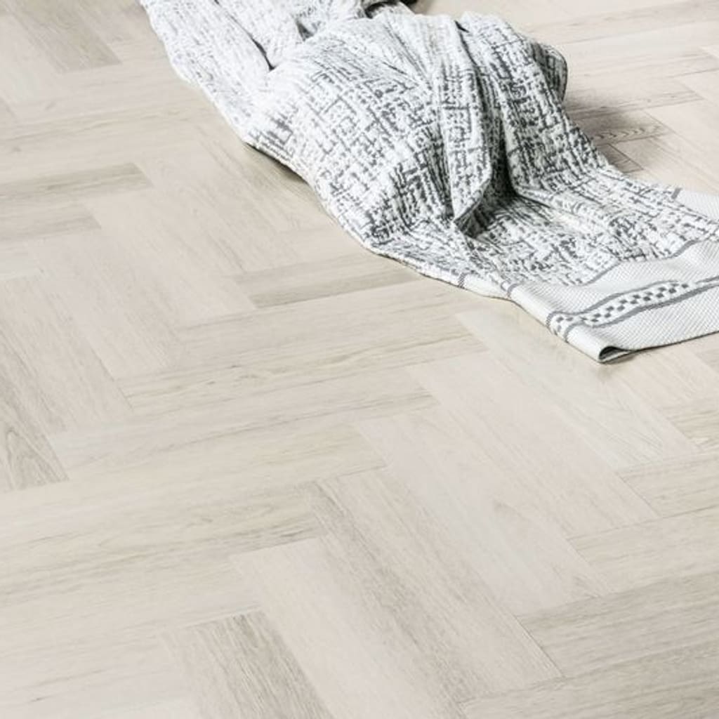 Close up of Pale Birch flooring with a textured blanket showing the realistic wood grain