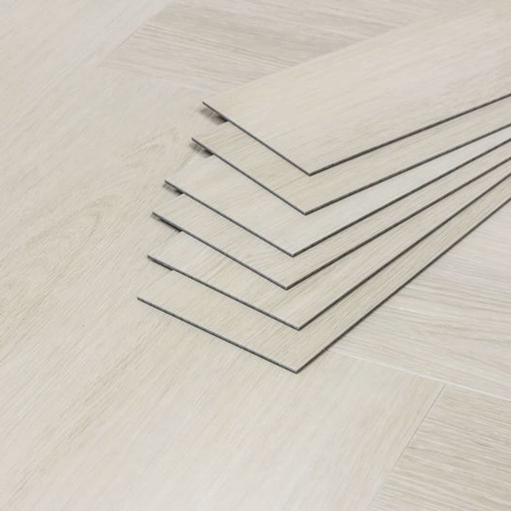 A stack of Pale Birch luxury vinyl tiles showing the 3mm thickness and profile