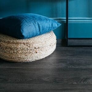 Close up top down view of Smoked Oak wood effect flooring sample showing grain detail