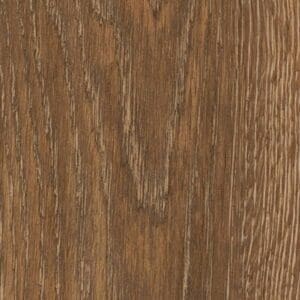 Close up of Toasted Oak Chevron luxury vinyl flooring showing realistic wood grain texture.