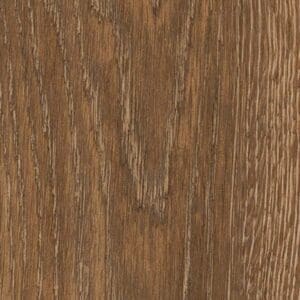 Toasted Oak herringbone flooring in a cosy living room setting with white armchairs