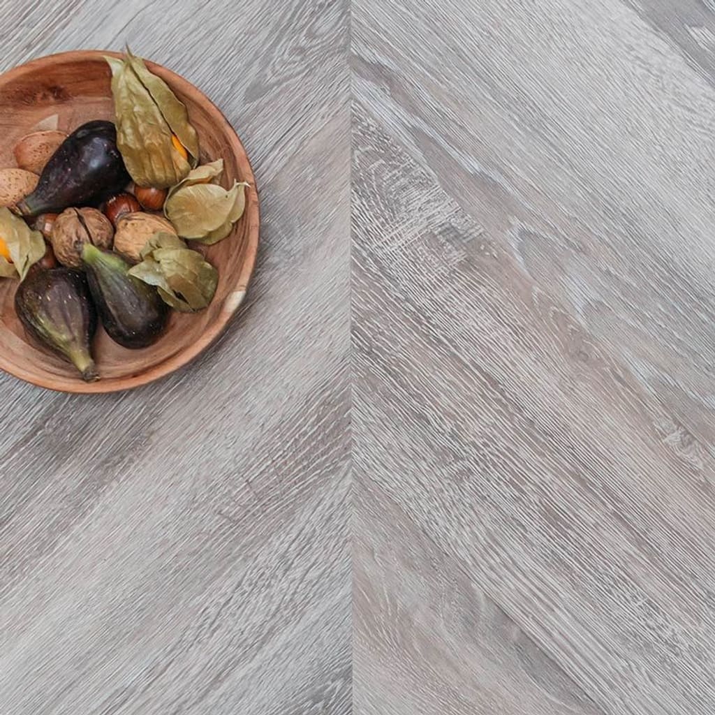 Detailed view of the realistic wood grain surface finish of Torn Bracken flooring