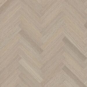 A top down view of Vermont Ash herringbone luxury vinyl flooring showing the light wood grain pattern.