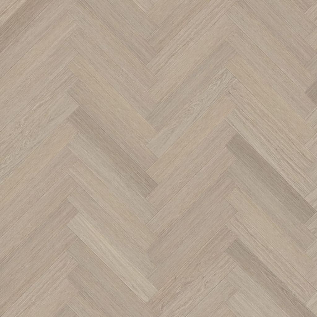 A top down view of Vermont Ash herringbone luxury vinyl flooring showing the light wood grain pattern.