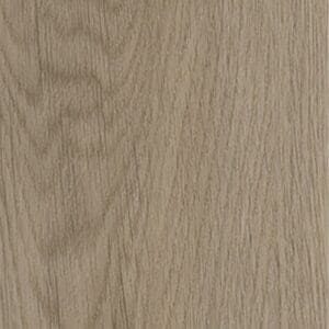 Close up of light oak effect parquet flooring in a herringbone pattern