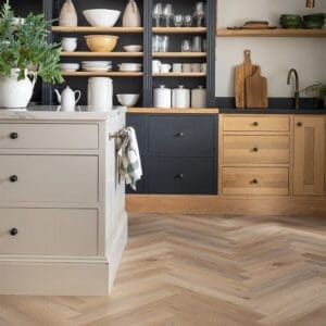 Wicker Parquet flooring installed in a modern kitchen with dark cabinetry